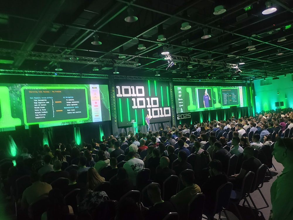 jPrime 2025 — Conference hall with main stage and green-themed screens